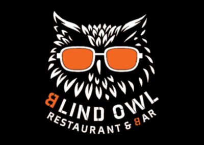 Logo of a white, spiky hedgehog wearing orange sunglasses on a black background with curved text reading 'RESTAURANT & BAR' (orange ampersand).